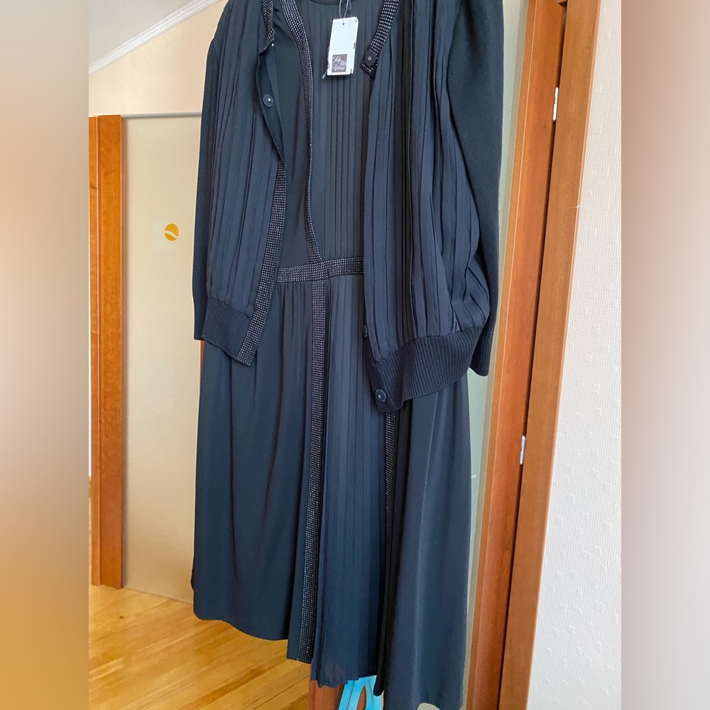 St. John sleeveless evening pleated, embellished dress with a matching jacket.